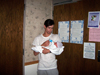 Daddy Jeron holding 1-day old Sean